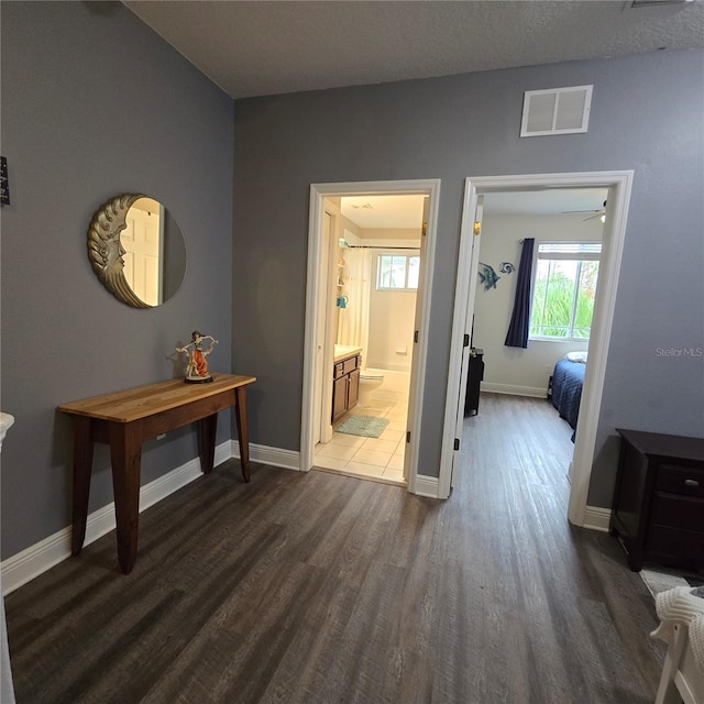 hallway with dark wood-type flooring