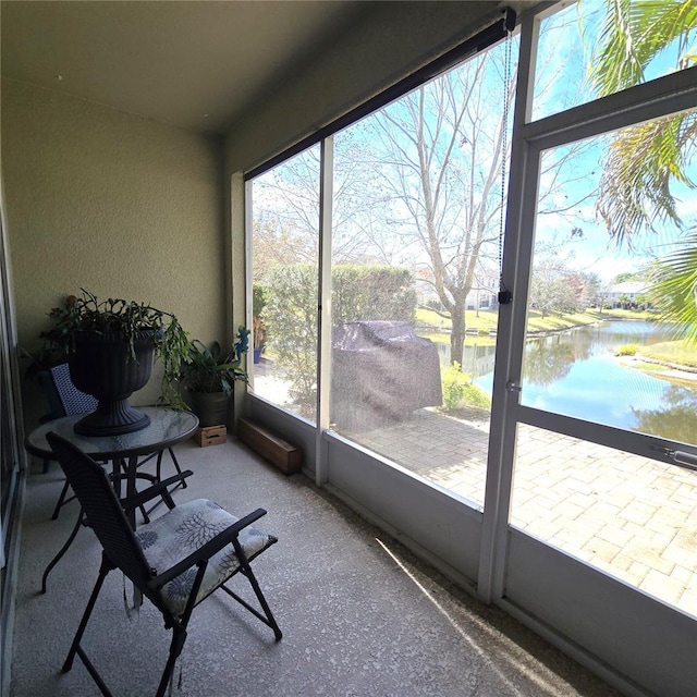 sunroom with a water view