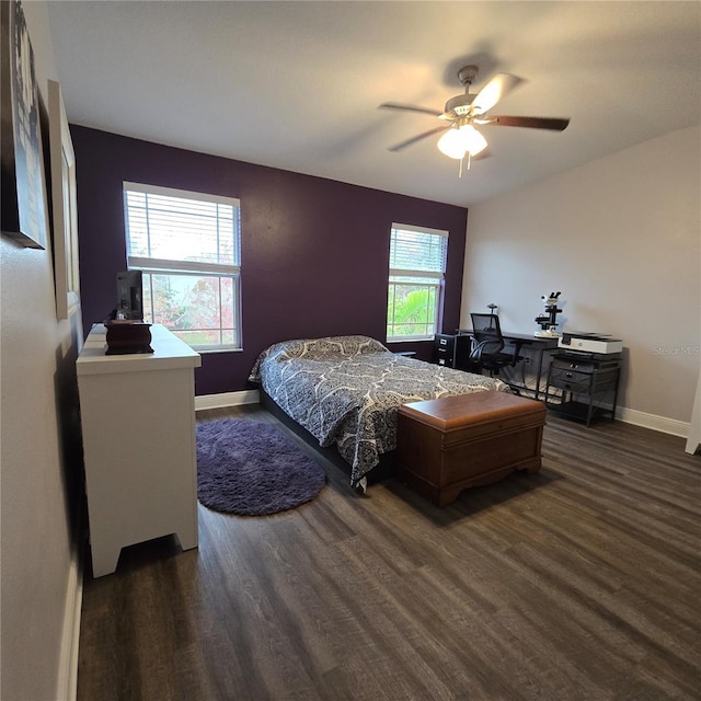 bedroom with dark wood-type flooring and ceiling fan