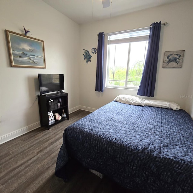 bedroom featuring ceiling fan and dark hardwood / wood-style floors