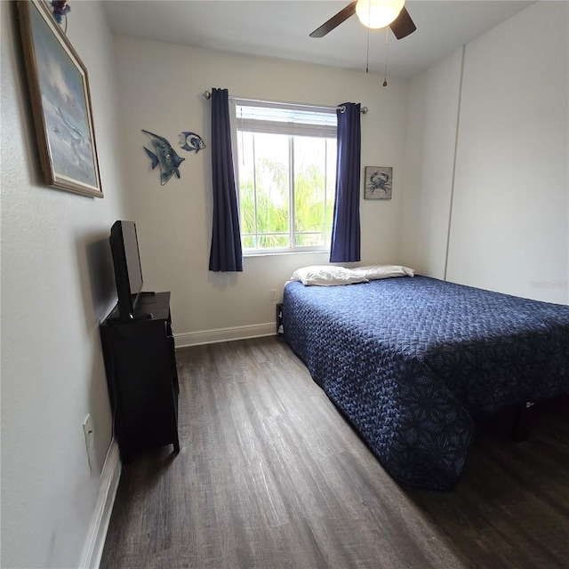 bedroom with wood-type flooring and ceiling fan