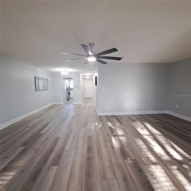 unfurnished room featuring hardwood / wood-style floors and ceiling fan