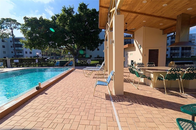 view of swimming pool with a patio