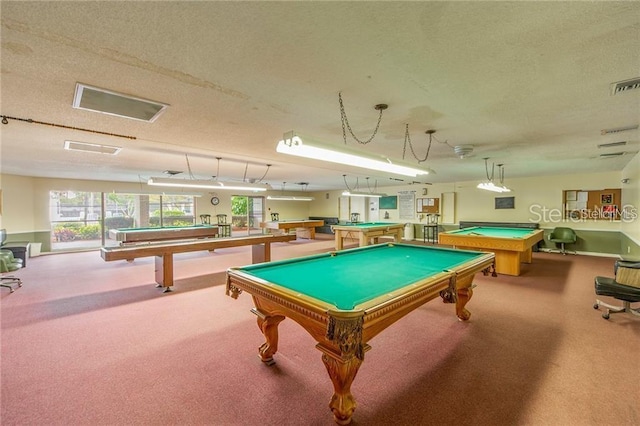 rec room featuring pool table, light colored carpet, and a textured ceiling