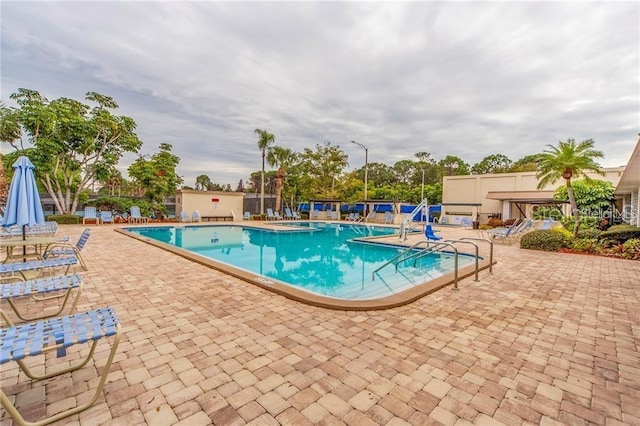 view of swimming pool with a patio