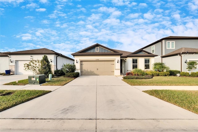 view of front of house with a front yard and a garage