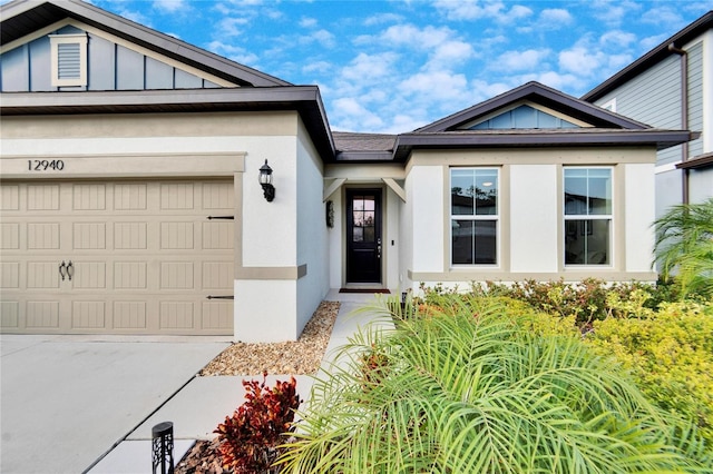 view of exterior entry featuring a garage