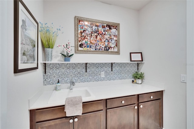 bathroom with decorative backsplash and vanity