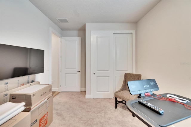 office area featuring light colored carpet