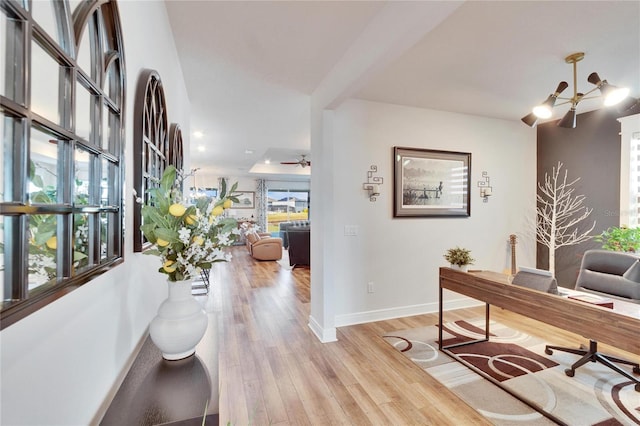 office area with light hardwood / wood-style flooring and plenty of natural light