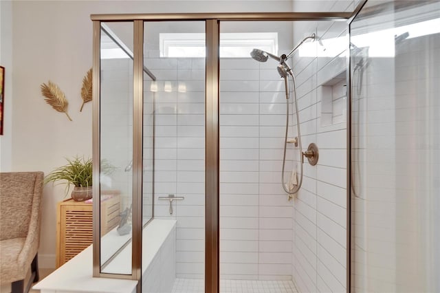 bathroom featuring a shower with door