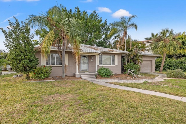 ranch-style house with a garage and a front lawn