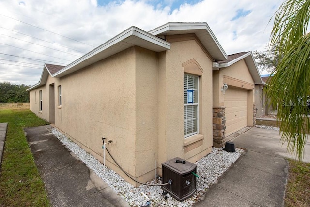 view of side of property featuring a garage