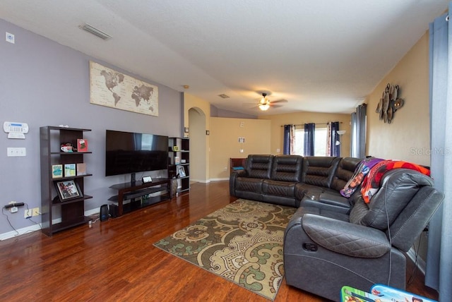 living room with dark hardwood / wood-style floors and ceiling fan