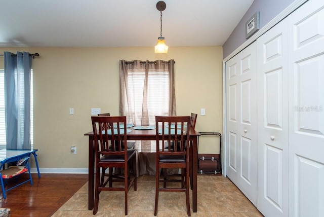 dining space with light wood-type flooring