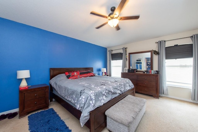 bedroom featuring ceiling fan and light colored carpet