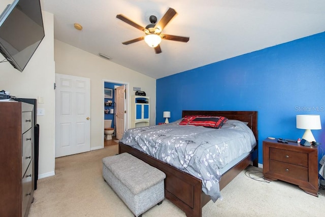 bedroom with light carpet, vaulted ceiling, and ceiling fan