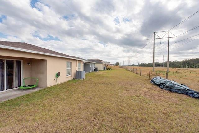 view of yard featuring central AC unit