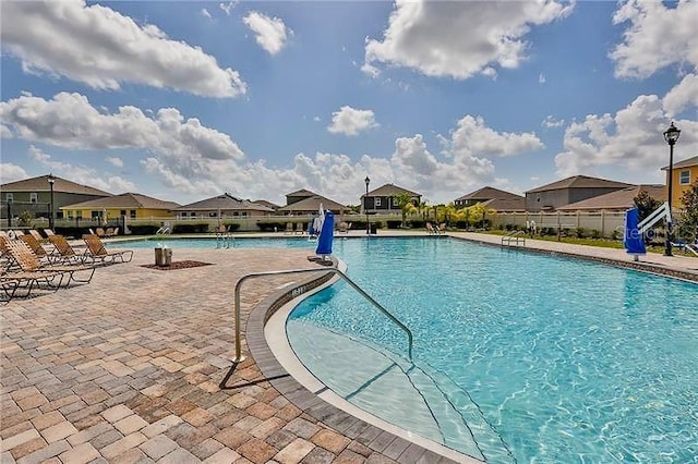 view of swimming pool featuring a patio