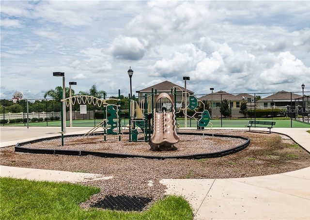 view of play area with basketball hoop and tennis court