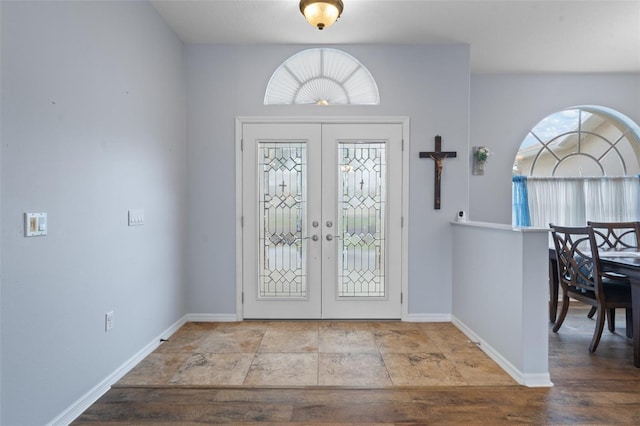 foyer entrance featuring french doors