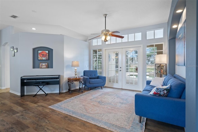 living room featuring ceiling fan, dark hardwood / wood-style floors, vaulted ceiling, and french doors