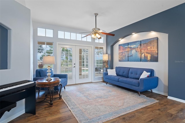 living room featuring ceiling fan, french doors, and dark hardwood / wood-style floors