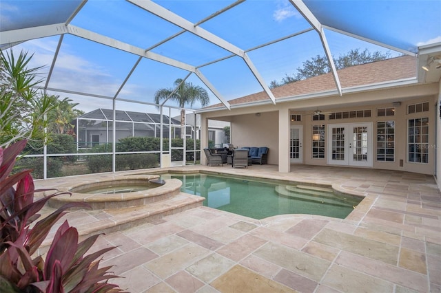 view of swimming pool featuring a lanai, an in ground hot tub, a patio, and french doors