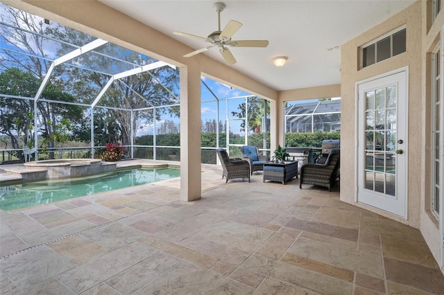 view of swimming pool featuring a lanai, outdoor lounge area, an in ground hot tub, and a patio