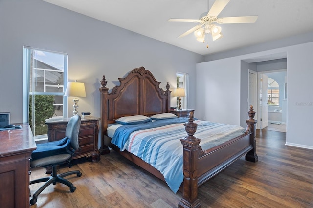 bedroom featuring ceiling fan, dark hardwood / wood-style flooring, and ensuite bathroom