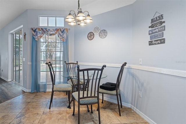 dining space with an inviting chandelier