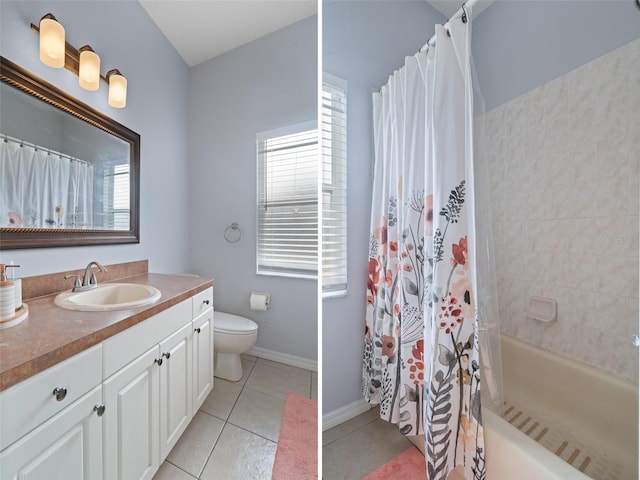 full bathroom featuring tile patterned flooring, vanity, plenty of natural light, and toilet