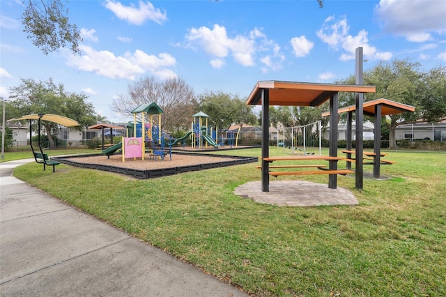 view of jungle gym with a lawn