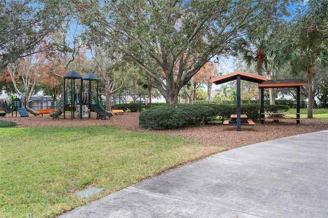 exterior space featuring a playground and a lawn