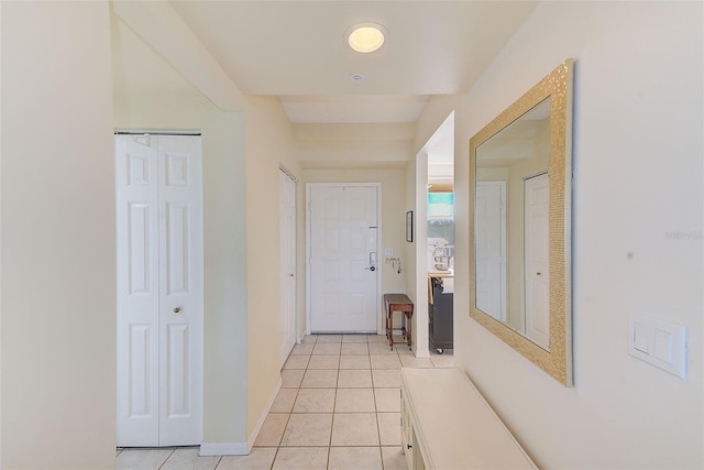 corridor featuring light tile patterned flooring