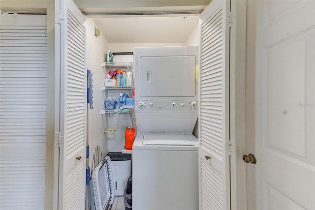 clothes washing area with stacked washer / drying machine