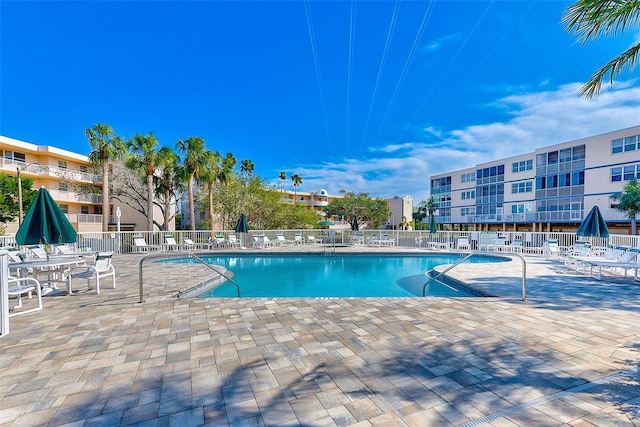 view of swimming pool with a patio