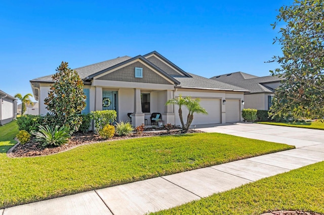 view of front facade with a garage and a front yard