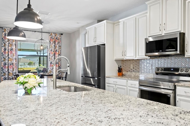 kitchen featuring white cabinetry, appliances with stainless steel finishes, and sink