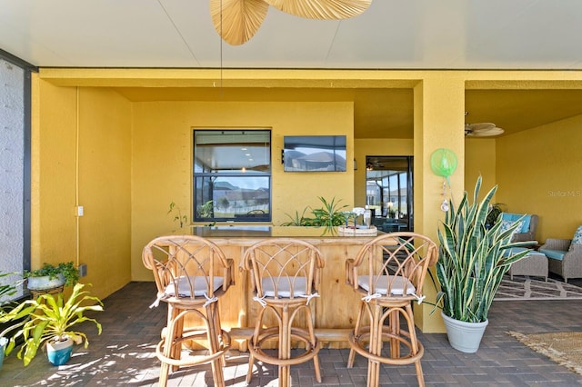 view of patio / terrace featuring exterior bar