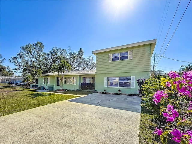 view of front property with a front lawn