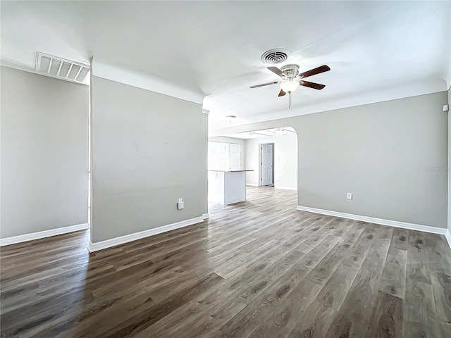 unfurnished living room with dark hardwood / wood-style flooring