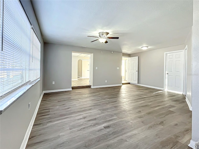 spare room featuring ceiling fan and hardwood / wood-style flooring