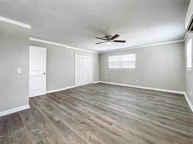 unfurnished bedroom featuring dark hardwood / wood-style flooring, ornamental molding, a textured ceiling, ceiling fan, and a closet