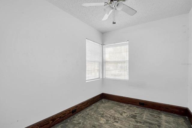 unfurnished room featuring a textured ceiling and ceiling fan