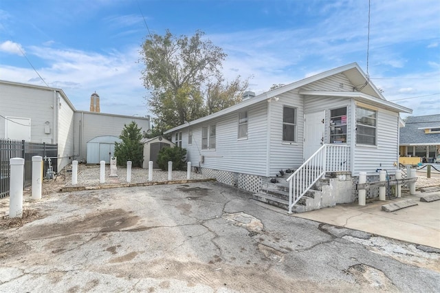 manufactured / mobile home with a storage unit and a patio