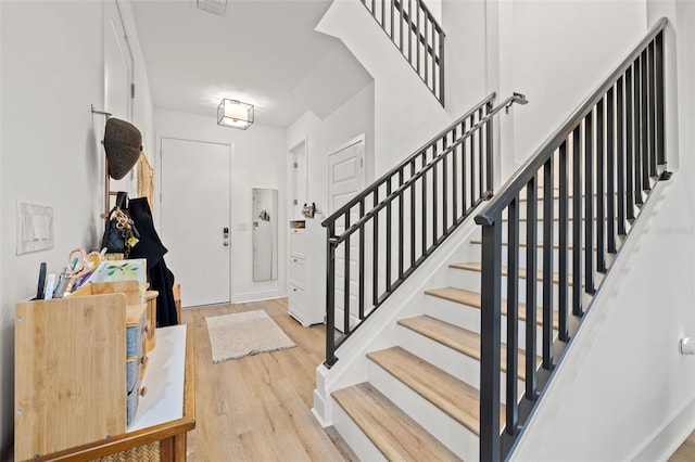 entryway with wood-type flooring