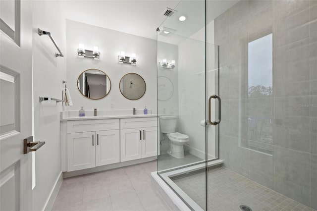 bathroom with toilet, tile patterned flooring, a shower with door, and vanity