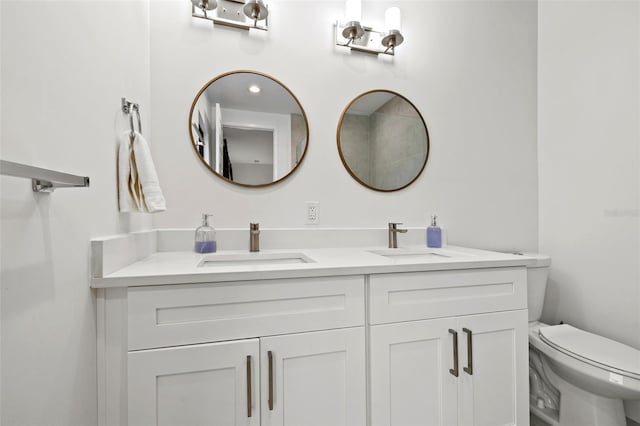 bathroom with toilet and vanity