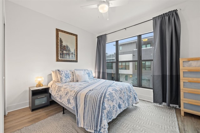 bedroom featuring ceiling fan and hardwood / wood-style floors